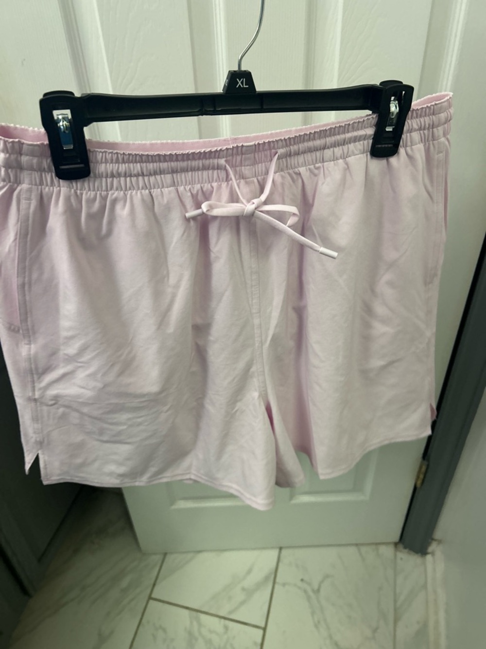 NWOT LULULEMON light pink athletic shorts, lined.